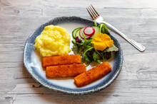 Fish Fingers With Potato Mash, Salad With Eatable Flowers