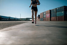 Woman Jogging In An Industrial Park