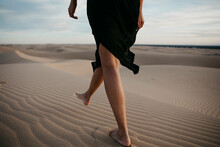 Crop View Of Woman Walking Barefoot On Sand Dune, Algodones Dunes, Brawley, USA