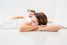 Man And Woman Enjoying The Whirlpool In A Spa