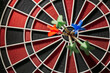 © DREAMSTOCK1982/Westend61 - Close-up of darts in bull's eye of electronic dartboard