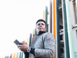 © Jose Carlos Ichiro/Westend61 - Portrait of elegant young man using phone