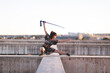 © Jose Carlos Ichiro/Westend61 - Young female athlete practicing sword on structure against clear sky during sunset