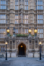 UK, England, London,ÔøΩStreet Lights Glowing In Front OfÔøΩPalace Of Westminster Entrance At Dusk