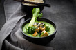 © Larissa Veronesi/Westend61 - Green thai curry with spinach, pak choi, tofu, sour cream, black sesame and jasmine rice