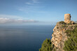 © Pascal Miller/Westend61 - Abandoned lookout tower on cliff by sea against blue sky, Majorca, Spain