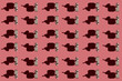 © Westend61 - Pattern of small brown donkey figurines against pastel red background