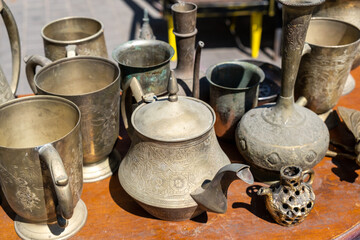 Wall Mural - Vintage copper tableware for sale at the flea market