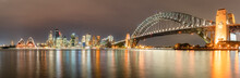 Panoramic Shot Of Illuminated Sydney Harbor Bridge Over River At Sydney, Australia
