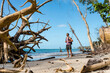 © mauro grigollo/Westend61 - Tourist with backpack standing on a tropical beach, Cahuita National Park, Costa Rica