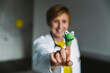 © Mareen Fischinger/Westend61 - Close-up of happy doctor showing finger doll