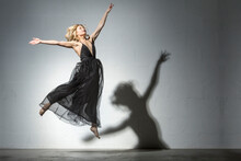 Blond Woman Dancing In Black Dress