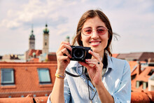 Young Smiling Woman Taking Picture