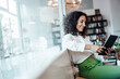© Joseffson/Westend61 - Young businesswoman using digital tablet while sitting at cafe