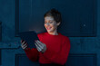© A. Tamboly/Westend61 - Portrait of smiling businesswoman using digital tablet at twilight