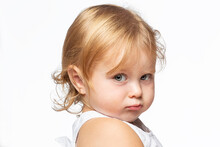 Portrait Of Pouting Blond Girl, White Background