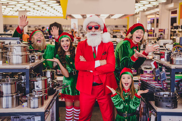 Sticker - Portrait of attractive cheerful funky company elfs buying goods having fun advent bargain opening December at mall store indoors