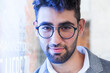 © Thomas Degen/Westend61 - Portrait of bearded young businessman wearing glasses
