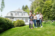 © MiJo/Westend61 - Happy extended family standing in garden of their home