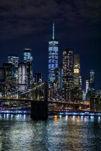 Skyline At Night With East River And Brooklyn Bridge, Manhattan, New York City, USA
