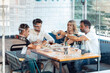 © JOSEP SURIA/Westend61 - Friends enjoying meal at restaurant seen through window