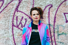 1980s Retro-styled Woman Standing In Front Of A Wall With Graffiti