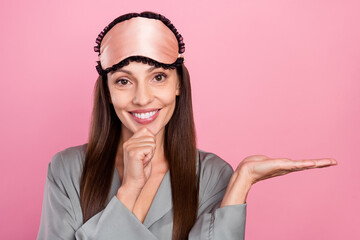 Sticker - Portrait of attractive cheerful woman holding copy space on palm decision idea isolated over pink pastel color background