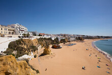 Scenic View Of Sandy Beach Against Clear Sky At Albufeira, Algarve, Portugal