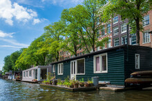 The Netherlands, North Holland Province, Amsterdam, Houseboat With Small Garden On Prinsengracht Canal
