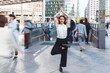 © William Perugini/Westend61 - Young businesswoman practising yoga in the city at rush hour, Berlin, Germany
