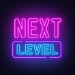 Next level neon sign on brick wall background.