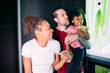 © Eugenio Marongiu/Westend61 - Happy parents with daughter brushing teeth in bathroom at home