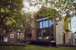 © Maya Claussen/Westend61 - Exterior of modern tiny house