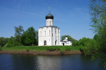 Wall Mural - Russia, Bogolyubovo - May, 2021: Church of the Intercession on the Nerl. Orthodox church and a symbol of medieval Russia, Vladimir region