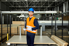 Portrait Of Worker With Tablet In Factory Warehouse