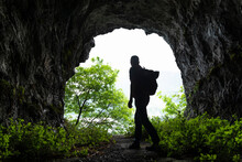 Mature Male Hiker Walking While Exploring Cave