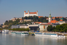 Slovakia, Bratislava, Cruise Ships Moored On Danube River And Bratislava Castle