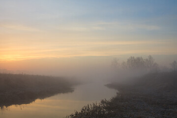 Wall Mural - morning fog over the river red dawn