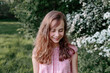 © Westend61 - Portrait of a smiling girl in nature