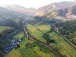 © chartphoto - Aerial view of agriculture in paddy rice fields for cultivatio, agricultural land with green in countryside, Agriculture concept growing rice plants in nan province, Thailand. Nature Aerial footage