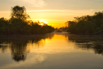 Wall Mural - morning fog over the river red dawn