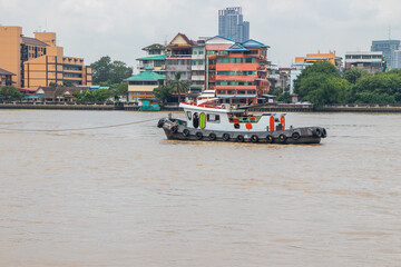 Sticker - Transport ships on their way in the area of the Chao Phraya River in Bangkok Thailand