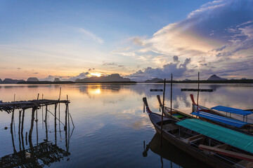 Ban Sam Chong Tai and colorful sunrises that emerges behind the giant limestone mountains, Thailand