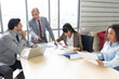 © offsuperphoto - businesspeople team meeting and brainstorming works on the table in conference room