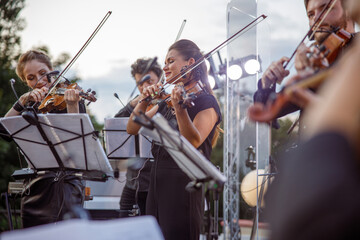 Violin players giving concert on the street