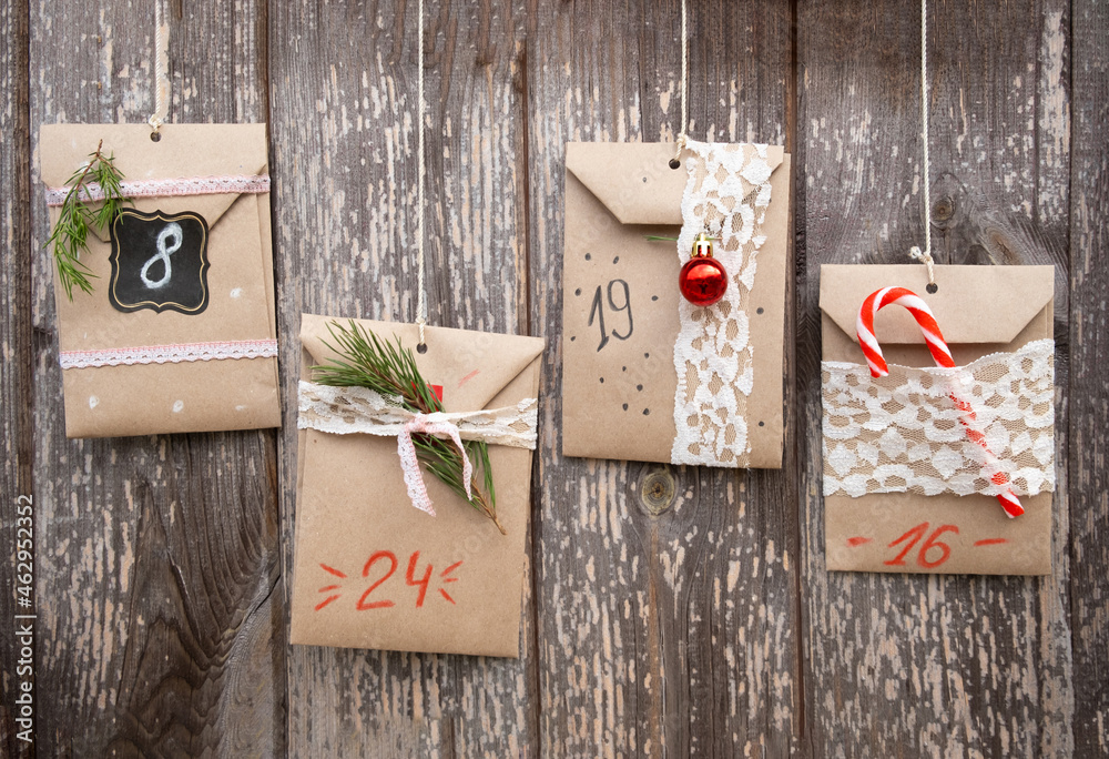 Christmas Advent Calendar. Sweets hidden in paper bags hanging on ...