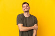 © luismolinero - Young caucasian handsome man isolated on yellow background laughing