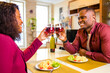 © yurakrasil - african american couple in love drinking wine from glasses and eating italian pasta in living room 14 february valentines day