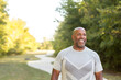 © digitalskillet1 - Mature African American man taking a walk outside.