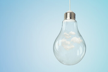 Wall Mural - Light bulb on light blue background